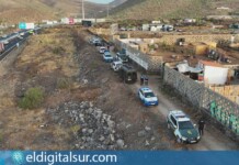 Agentes de distintos cuerpos policiales y personal técnico participan en el macrooperativo desarrollado en el asentamiento irregular de Los Vivitos, en el municipio de Arona